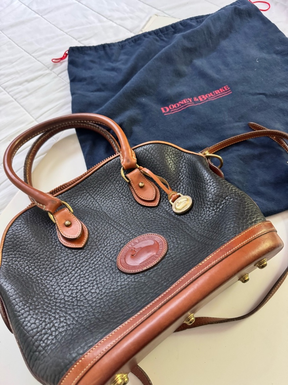 Dooney & Bourke Black Pebbled Leather Satchel with Brown Trim and Gold Hardware